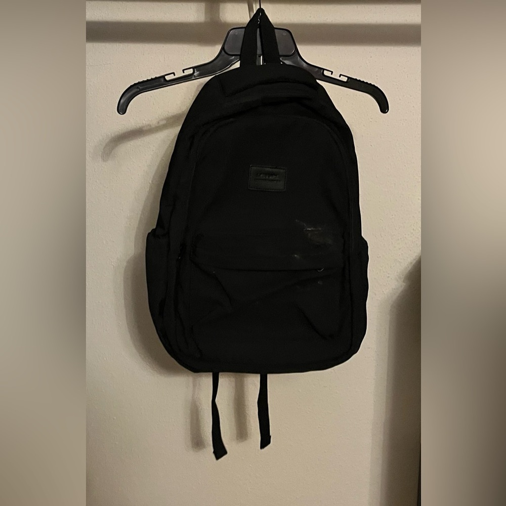 Black Textured Canvas Backpack with Layered Design
